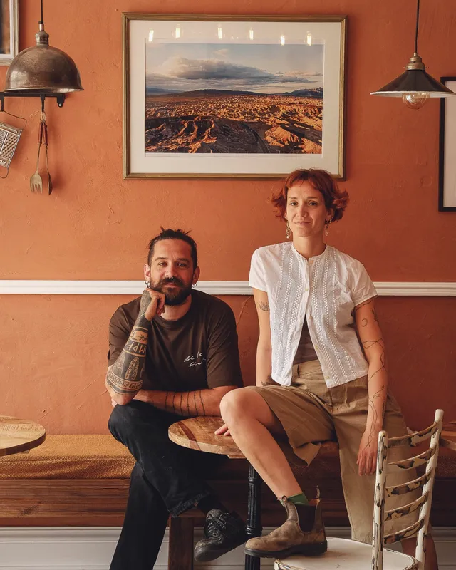Two of the siblings sitting in the café